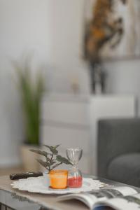 a table with a plate with a wine glass on it at Exclusive Csengery Residence in the heart of Budapest in Budapest