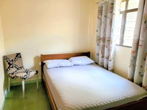 Ένα ή περισσότερα κρεβάτια σε δωμάτιο στο Pousada Romeiros do Pai Eterno