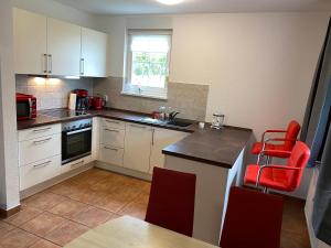 Kuchyň nebo kuchyňský kout v ubytování Moderne Apartments im Ferienpark auf Rügen + 8 fotografií