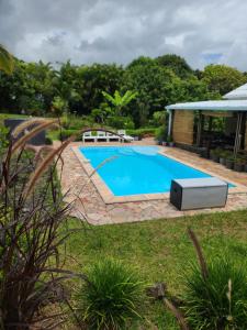 The swimming pool at or close to Eden des laves