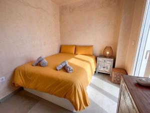 Łóżko lub łóżka w pokoju w obiekcie Tarifa Cozy House - Minimaliste