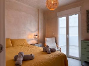 Łóżko lub łóżka w pokoju w obiekcie Tarifa Cozy House - Minimaliste