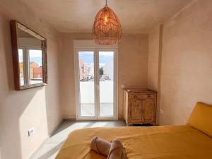 Łóżko lub łóżka w pokoju w obiekcie Tarifa Cozy House - Minimaliste