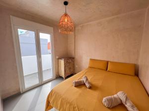 Łóżko lub łóżka w pokoju w obiekcie Tarifa Cozy House - Minimaliste