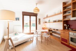 a room with a bed and a table and chairs at Marcona Apartment in Milan