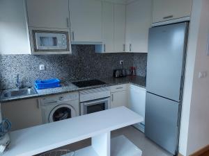Kuchnia lub aneks kuchenny w obiekcie Apartamento con jardín
