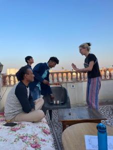 a group of people standing around a sink at S A HAVELI GUEST HOUSE in Bikaner