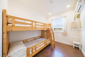 En eller flere senge i et værelse på Gallery Sohee's House