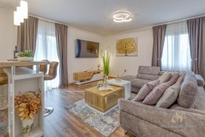 a living room with a couch and a table at Apartment Nina Pazin in Pazin