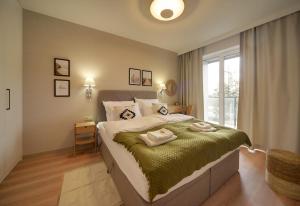 Posteľ alebo postele v izbe v ubytovaní Apartament Dziwnów Sagaris Spa