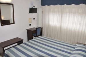 Letto o letti in una camera di Hotel Sud Ovest