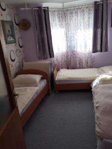 Postel nebo postele na pokoji v ubytování Gogo.