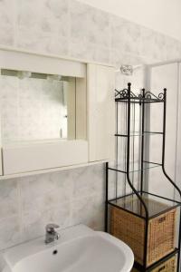 a bathroom with a sink and a mirror at Trulli Cibelis in Noci +12 photos