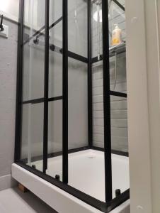 a glass cabinet with black bars on it at Alanko Old Cowhouse in Tornio