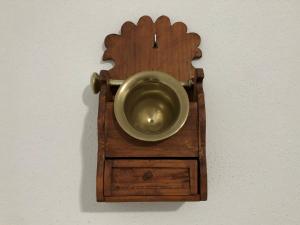 a wooden bowl in a wooden holder on a wall at Cortijo los Garridos - 7 huéspedes in Almería