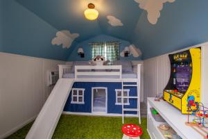 a childs bedroom with a blue ceiling and a play room at Blue Valley Inn - Hot Tub & Spacious Play Area! in Knoxville