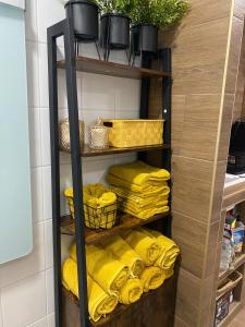 a shelf with yellow towels in a kitchen at Chalupa Oslany in Oslany
