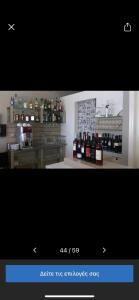 a picture of a kitchen with bottles of wine at Hotel Barbati Sea View B&B in Barbati