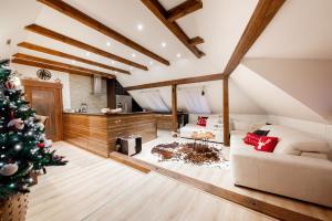 a living room with a christmas tree and a couch at Farma František in Stachy