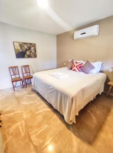 En eller flere senge i et værelse på Pousada Villa Magna - Suite