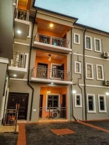 a building with two balconies on the side of it at Remarkable 2-Bed Apartment in Asaba in Asaba