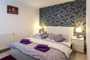 Postel nebo postele na pokoji v ubytování NISA Apartments