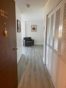 a hallway with a living room with a couch at Charming Micro studio in Gadsden, AL in Gadsden