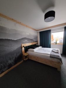 Posteľ alebo postele v izbe v ubytovaní Karolowy pokoje&apartamenty