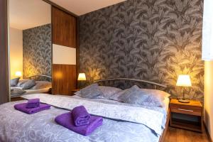 Postel nebo postele na pokoji v ubytování NISA Apartments