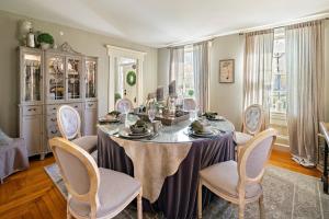 a dining room with a table and chairs at The Watson Boutique Bed and Breakfast in Thompson