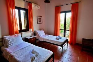 A bed or beds in a room at Danai villa