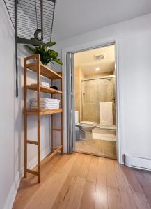 a bathroom with a shower and a toilet and a ladder at The Royal Bay Getaway in Victoria