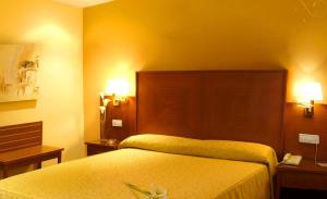 A bed or beds in a room at Casa Quiquet Még 5 kép