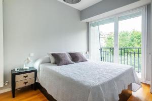 Posteľ alebo postele v izbe v ubytovaní Apartamento a 5min de la playa de Ondarreta