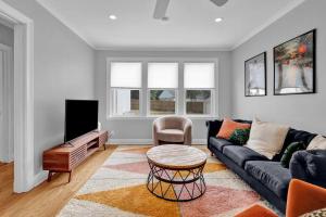 a living room with a couch and a table at High Point Terrace Bungalow in Memphis