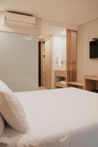 Voodi või voodid majutusasutuse Hotel Dix toas