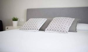 A bed or beds in a room at Clauhomes Vista Al Mar