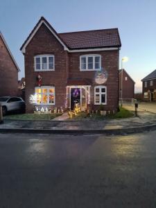 a house with christmas lights on the front of it at Ria's B n B in Pocklington