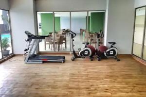 a gym with two treadmills and exercise bikes at Apartemen M Square 23m2 Jl. Cibaduyut No. 142 in Bandung