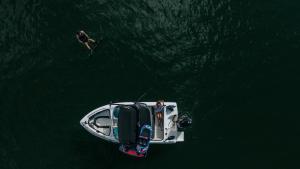 two people on a boat in the water at Domus Glamping Guatapé in Guatapé +99 photos