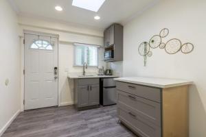 a kitchen with a sink and a counter top at @ Marbella Lane - Adorable and Quiet Studio in San Mateo +15 photos