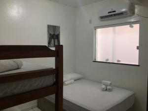 Giường trong phòng chung tại Casas do Matteo - 2ª Praia