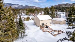 an aerial view of a house in the snow at Quiet place in the heart of Laurentides in Sainte-Lucie-de-Doncaster