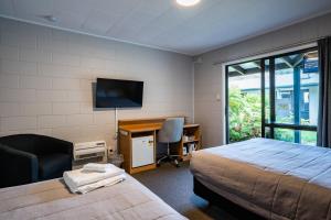 Katil atau katil-katil dalam bilik di Dawsons Hotel