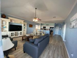 a living room with a couch and a table at Beach House with Ocean view in Surfside Beach