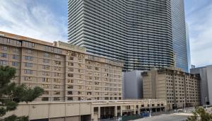 a large building with two tall skyscrapers at Suites at Jockey Club (No Resort Fee) in Las Vegas