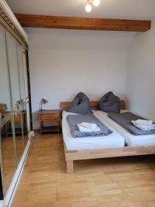 a bedroom with two beds in a room at Ferienhaus Vongerichten in Oberhausen