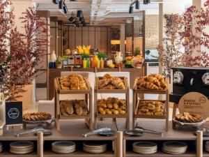 a display of different types of breads and pastries at Mercure Benidorm in Benidorm