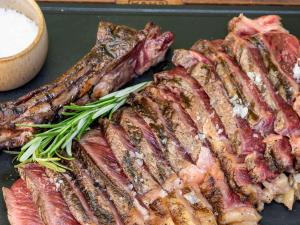 a bunch of meat on a tray with sauce at Mercure Benidorm in Benidorm
