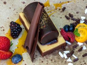 a dessert with chocolate and fruit on a table at Mercure Benidorm in Benidorm